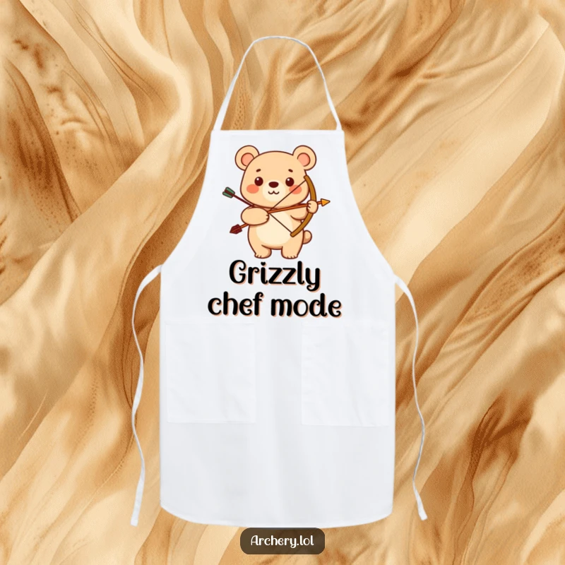 Funny apron with a smiling bear proudly holding a bow and arrow. Humorous and practical for kitchen activities.