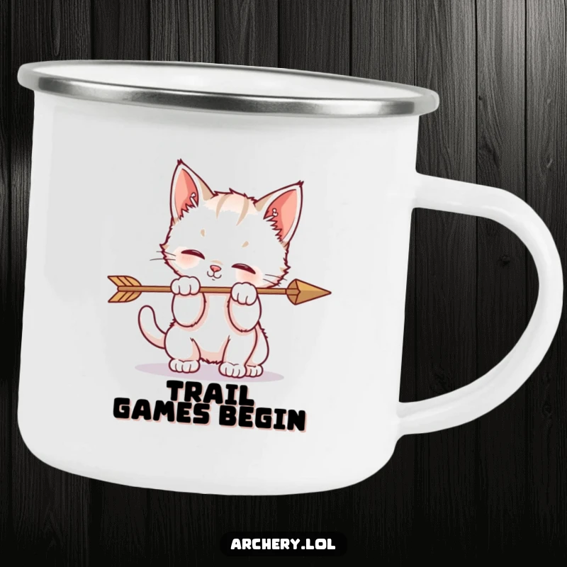 Funny camping mug featuring a kitten playfully batting at an arrow, perfect for outdoor fun and feline fans.