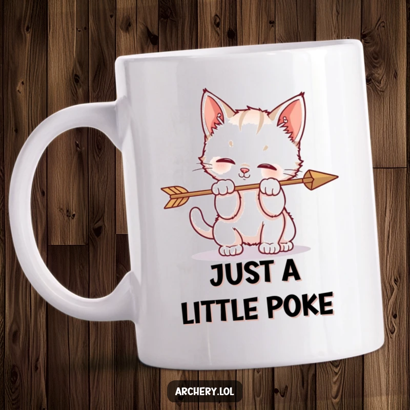 Funny mug showing a playful kitten batting at an arrow with its paws, embodying adorable, chaotic feline fun.