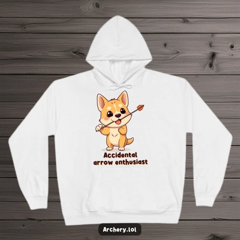Funny hoodie featuring a silly dog holding a bow, its arrow accidentally flying upwards, offering cozy humor for pet enthusiasts.