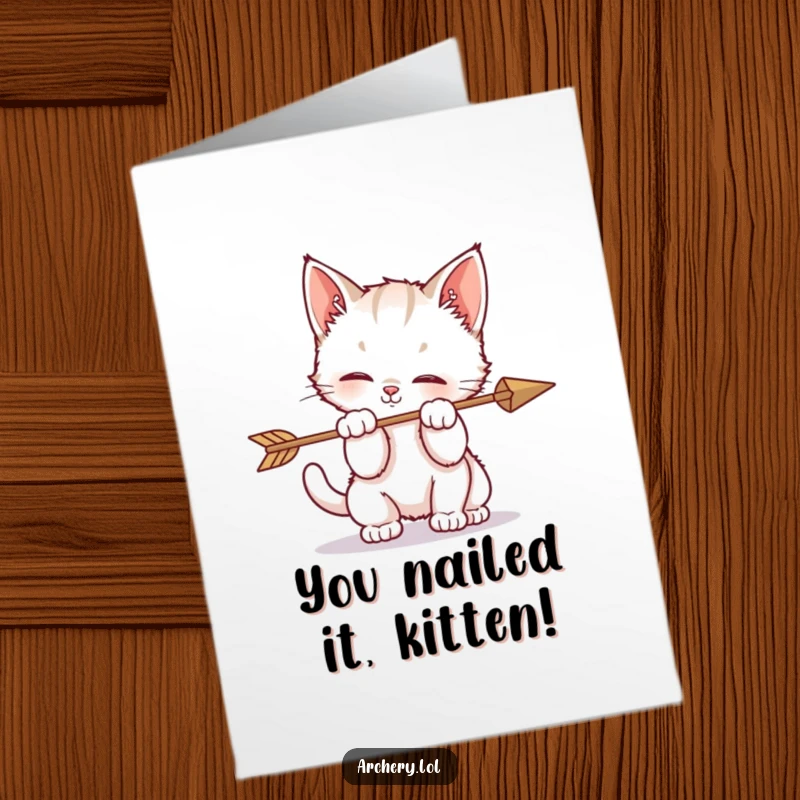 Funny Free Printable Congratulations Card: A playful kitten curiously bats at an arrow, making for a charming and humorous congratulatory message.