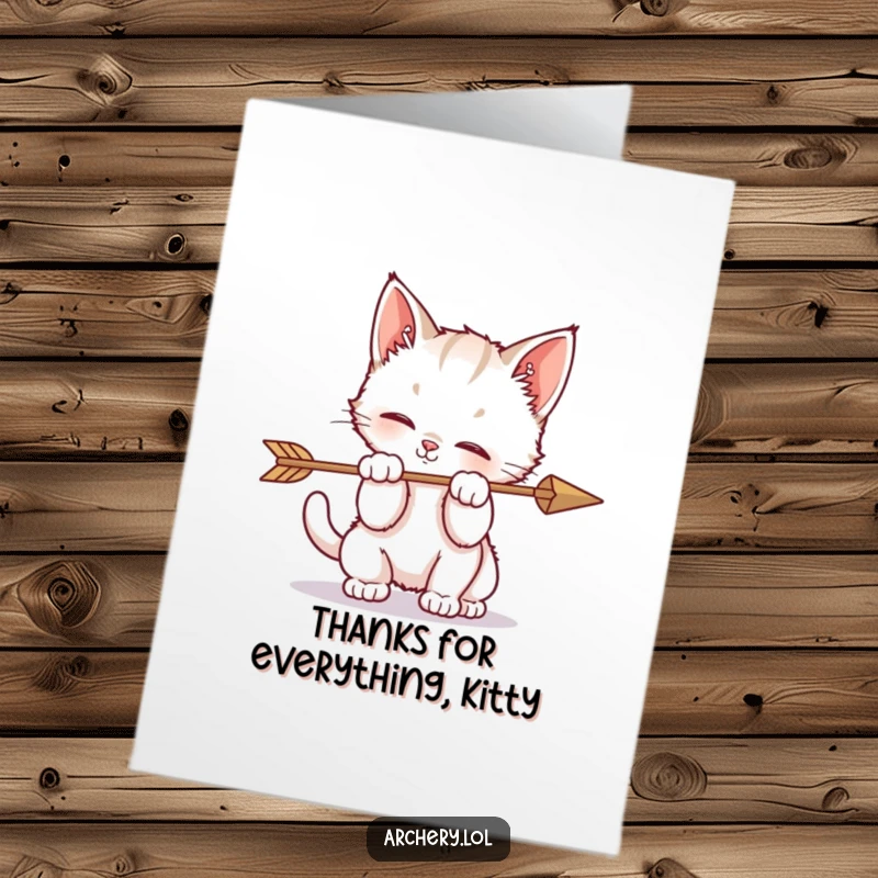 Funny Free Printable Thank You Card: A playful kitten batting curiously at an arrow, offering a cute and humorous way to say thanks.