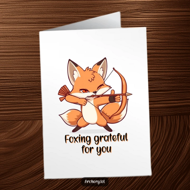 Funny Free Printable Thank You Card: A winking fox strikes a dynamic archery pose, aiming a thank you directly at them.